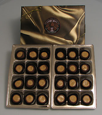 Buckeyes | 24 Piece Box - Ohio&#8217;s traditional chocolates are made with creamery butter, rich peanut butter, and confection sugar that are hand dipped in pure milk or dark chocolate.  These are absolutely the best buckeyes in Ohio!!!  Twenty-four buckeyes packed in our signature box