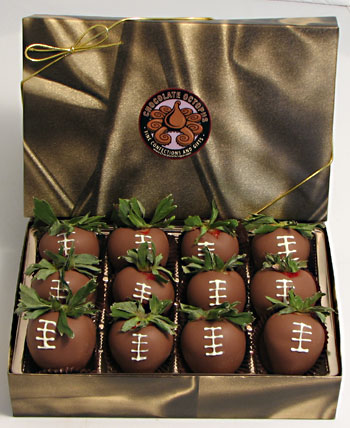 Football Chocolate Strawberries | 12 Piece Box - Twelve large whole strawberries are dipped in pure milk chocolate and decorated to look like a football.  The exquisite taste of fresh strawberries combined with the striking appearance of a football berry make this a great gift.  The twelve berries are packed in our signature box.  Out of Ohio, this must be shipped by next day air.