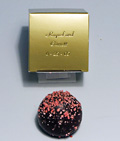Old World Truffles | 1-piece box - A round delicate outer chocolate shell is filled with a rich dark chocolate ganache and flavored with the purest of ingredients to create a distinctive and memorable taste sensation.  Each piece is beautifully decorated.  Price includes printing of box with a minimum quantity of 50 boxes.  Packed in a one-piece box.