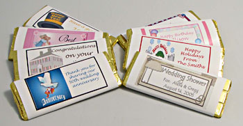 Bride and Groom Chocolate Bar - The bride and groom are embossed on this chocolate bar.  You have a choice of using our wrappers or design your own wrapper (extra charge) for the bar.  Personalization of our wrappers is included in the price.  This bar weighs over two ounces and is made from our pure chocolate formulation.  You can use this bar for a favor at the wedding table, seat assignments, or invitations.  A minimum of twenty-four pieces is needed for personalization.