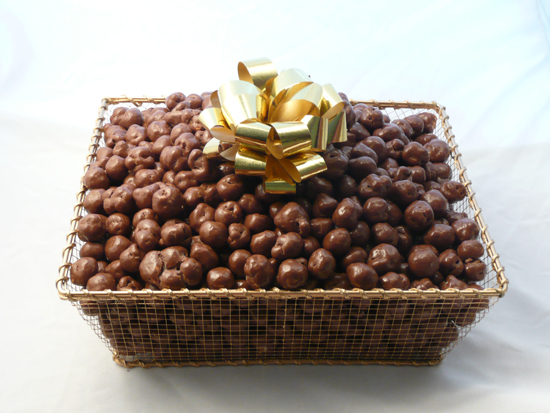 Golden Tray | Chocolate Covered Caramel Corn - Beautiful golden mesh tray is lusciously filled with over three and a half pounds of our extremely popular chocolate covered caramel corn.  The tray is shrink wrapped with a large bow on top.