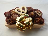 Chocolate Tray Basket | 1 Lb. - Flat wooden basket filled with decorative straw and layered with a twenty-five-piece assortment of fresh delectable Chocolate Octopus Signature Chocolates. Shrink-wrapped with a large bow help to complete a very visually edible gift. One-pound basket. 